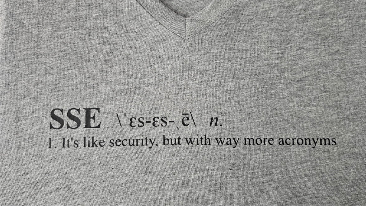 Gray V-neck shirt with black text defining 'SSE' and its humorous description.
